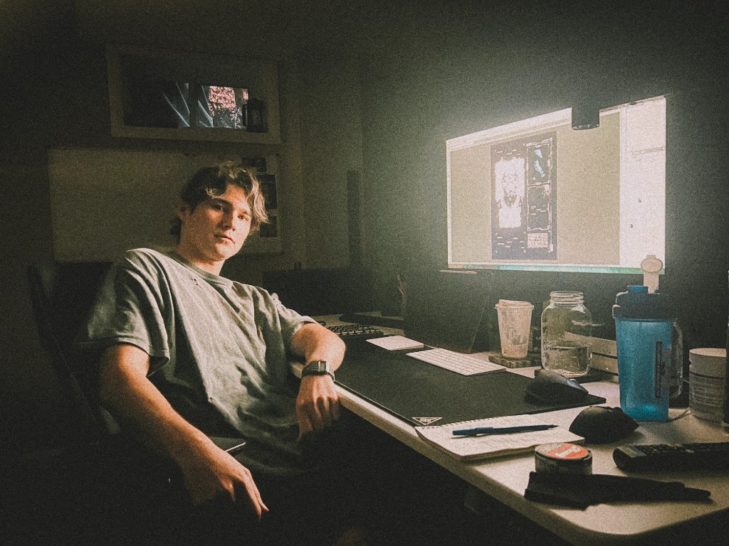 Ryan at his desk researching and designing Quote Legends artwork